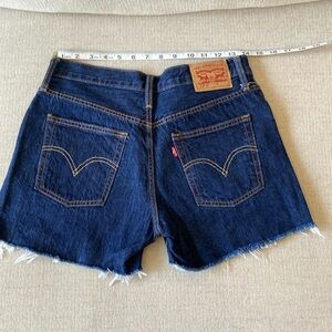 Levi's button-fly size 25 waist, cutoff denim shorts.